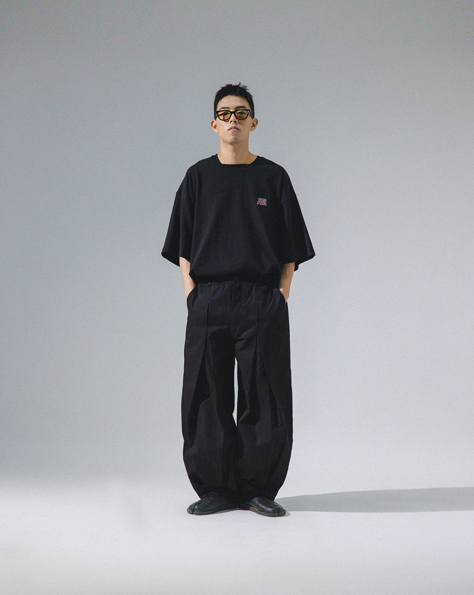 ANGLAN UNBALANCE LONG TUCK BALLOON PANTS - BLACK - THE GREAT DIVIDE