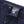 Load image into Gallery viewer, Close-up of blue denim jeans with a brand label on a white background
