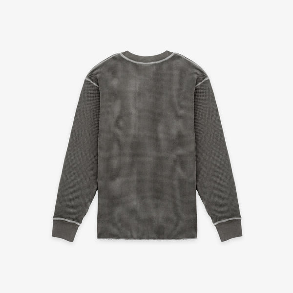A dark gray ribbed knit long-sleeve shirt with contrasting light gray piping details along the shoulders, cuffs, and collar, shown flat against a light gray background.