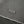 Load image into Gallery viewer, Close-up of a gray textured fabric with a visible woven brand patch reading 'BELLEWE' and a folded edge showing the material texture.
