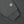 Load image into Gallery viewer, Close-up of a dark gray sweatshirt sleeve with a ribbed cuff and a circular white and black 'Tubble War' patch on the upper arm.
