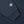 Load image into Gallery viewer, Close-up of a navy blue sweatshirt sleeve with a ribbed cuff and a circular embroidered patch reading 'TUBBLE WAR' on the upper sleeve.

