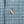 Load image into Gallery viewer, A light blue and white checkered long-sleeve button-down shirt with mother of pearl buttons.
