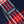 Load image into Gallery viewer, Close-up of a navy blue plaid fabric with red and white tartan pattern and a visible Dubbleware brand label.
