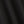 Load image into Gallery viewer, A close-up of dark charcoal gray knit fabric with soft folds showing the fine ribbed texture.

