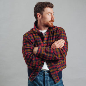 Double RL By Ralph Lauren - Wool-Blend Flight Jacket Jacket - Red Check - A man wearing a red and yellow plaid flannel shirt over a white t-shirt and blue jeans, standing with arms crossed against a plain gray background. - Alternative View 1